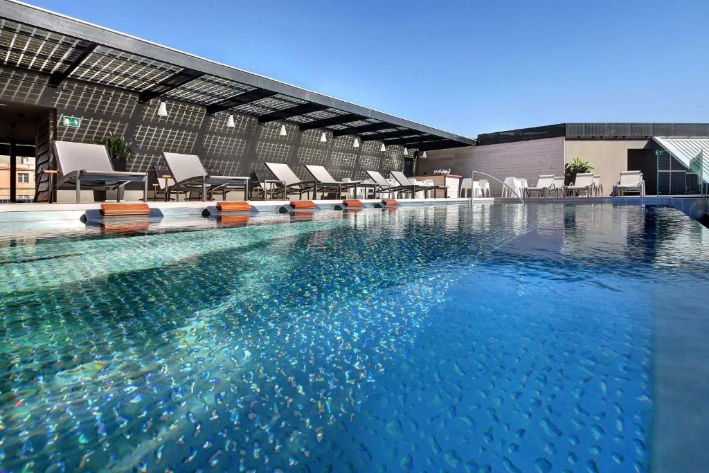 Outdoor pool at the Olivia Balmes Hotel