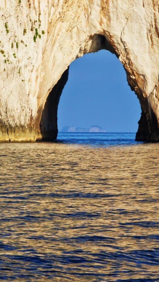 Amalfi's rocky coast framed by Faraglione di Mezzo
